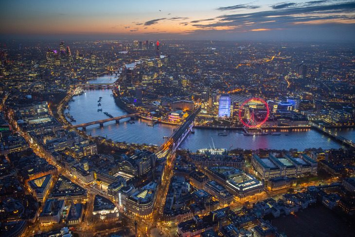 Before dawn, looking over River Thames with the London eye, Southbank and the Strand.